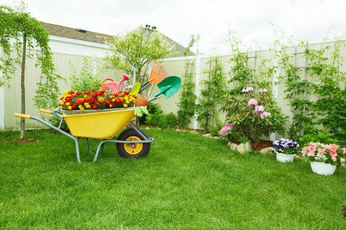 Professionals trimming a well-maintained hedge in a Seven Sisters garden