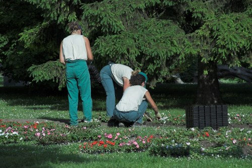 Team clearing cuttings with protective gloves and high-visibility clothing